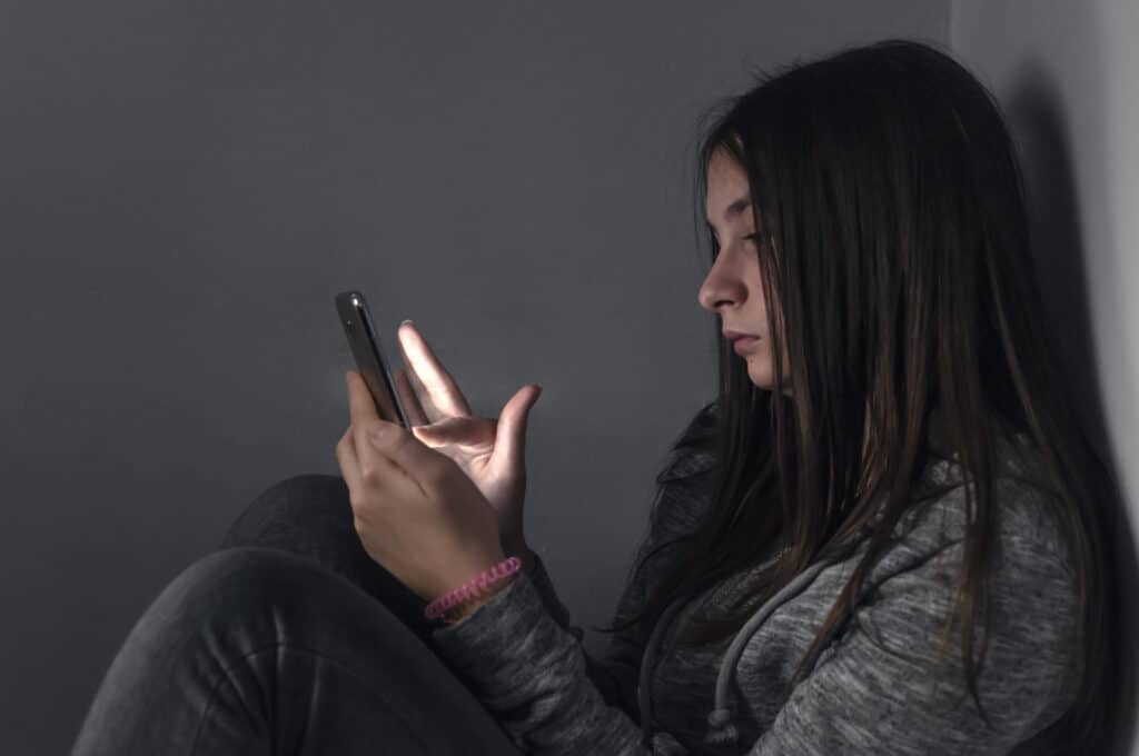 teen depression girl on phone